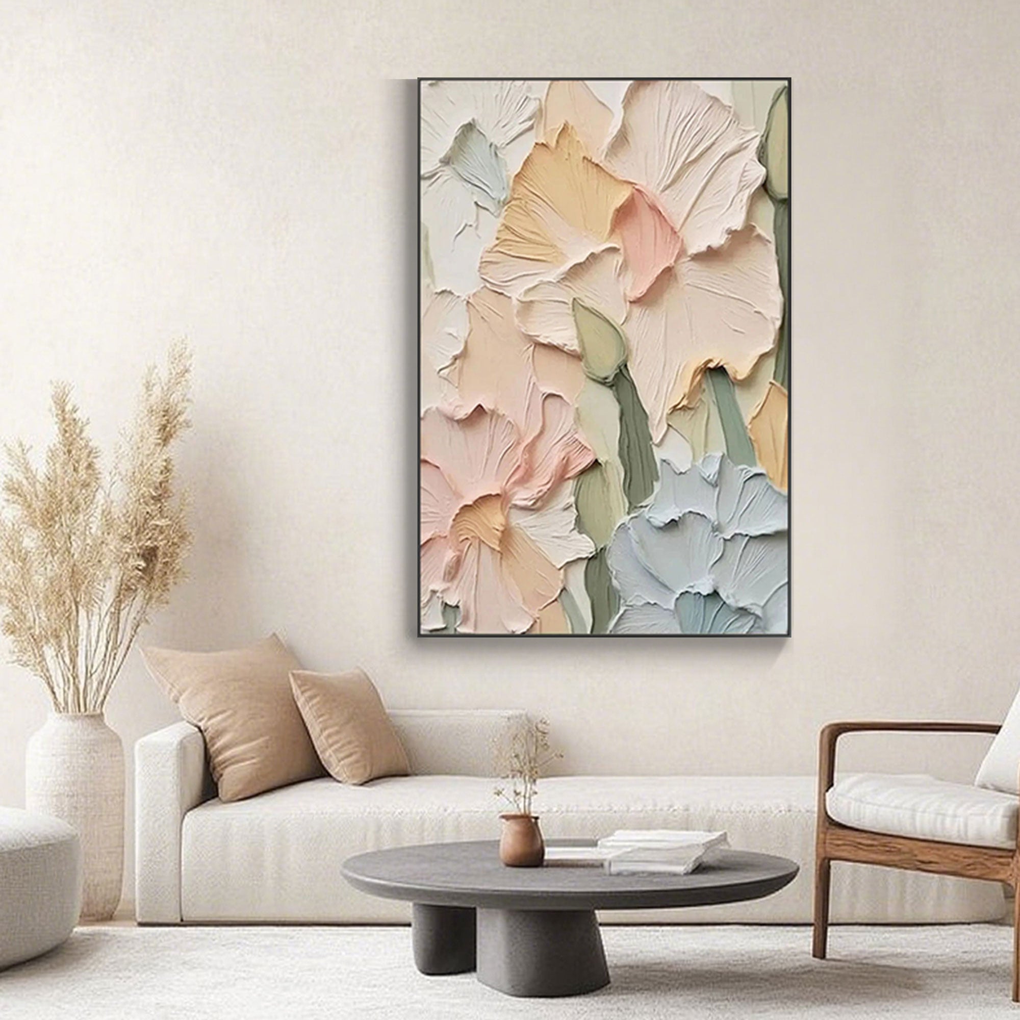 Textured floral painting with a black frame, mounted above a sofa.
