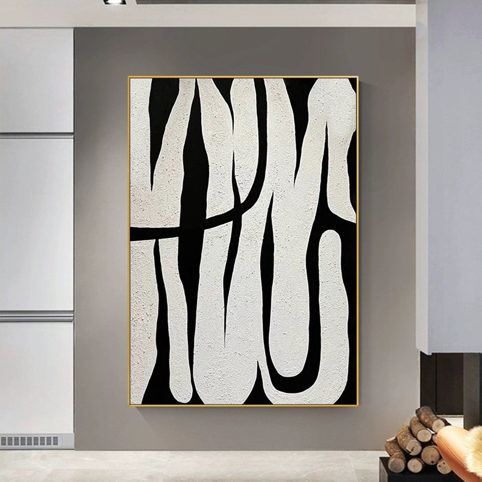 Black and white abstract line art, showcasing minimalist style, with black lines weaving across a white background, adding an artistic touch to modern interiors.