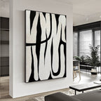 Black and white abstract line art, showcasing minimalist style, with black lines weaving across a white background, adding an artistic touch to modern interiors.