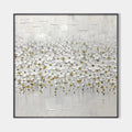 Close-up of white floral art with gold accents in a sleek black frame.