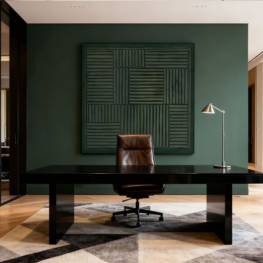 3D textured dark green geometric wall art with woven patterns, Wabi-Sabi style, displayed in a contemporary office with dark desk, brown leather chair, and silver lamp.