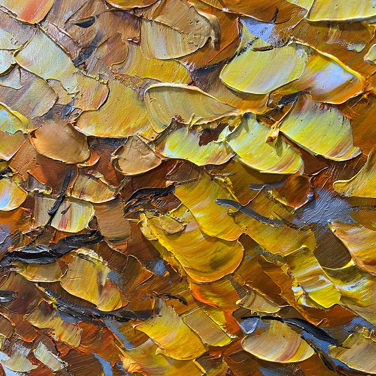 Close-up of textured impasto brushstrokes on gold tree painting.