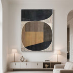Intersecta geometric art enhances a modern living room with earthy tones and abstract shapes.