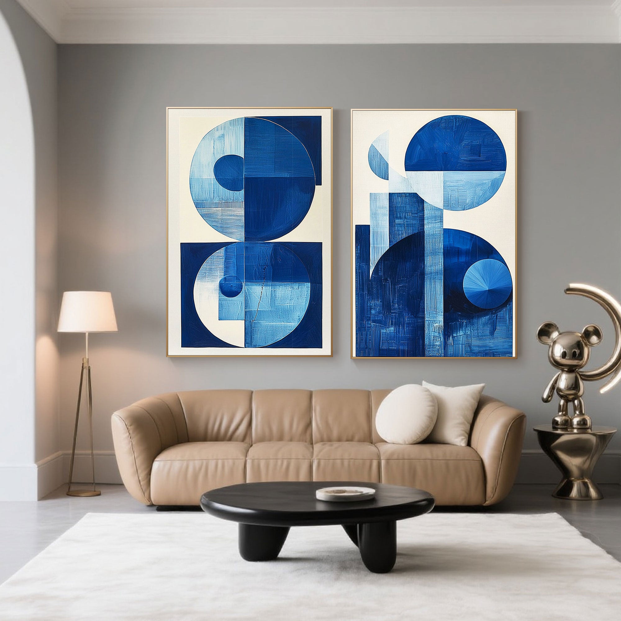 Luxury living room with black leather sofa and blue art