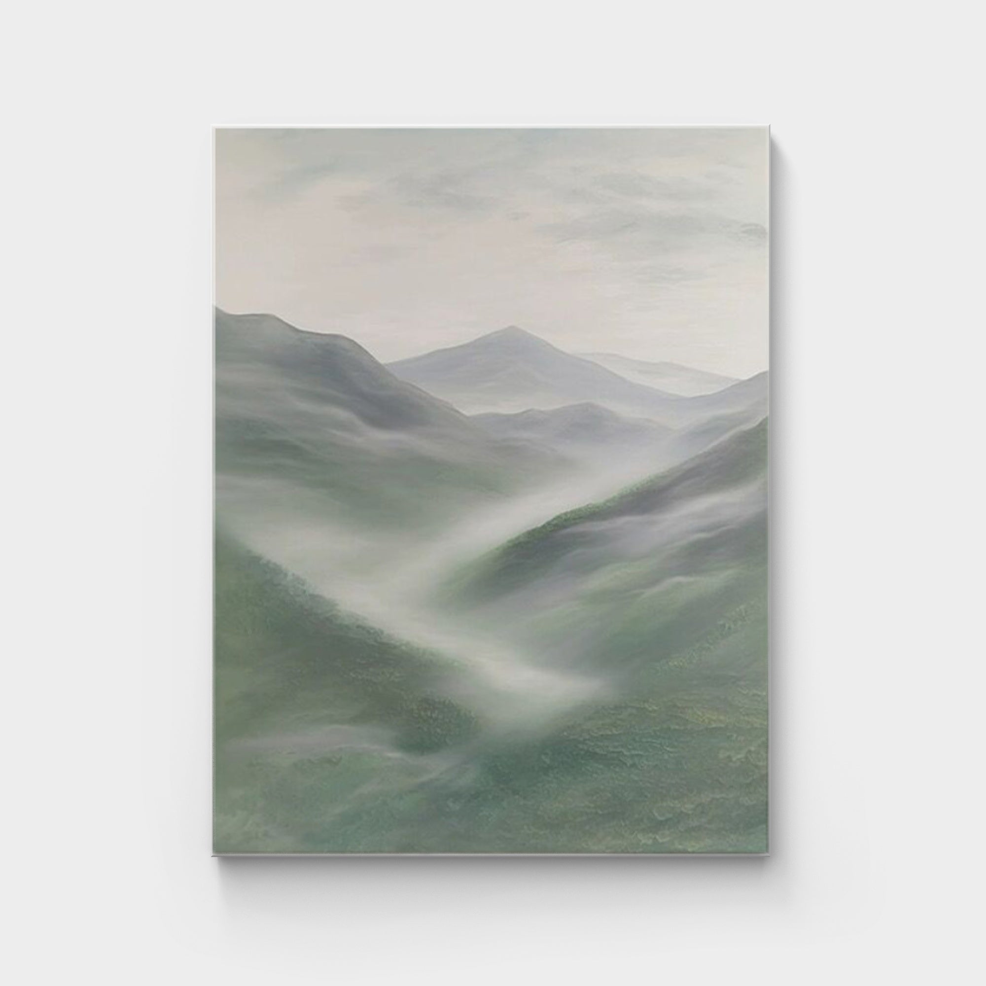 Green abstract mountain landscape painting, depicting misty mountains with soft green, grey, and white tones, adding tranquility and a natural touch to modern decor.