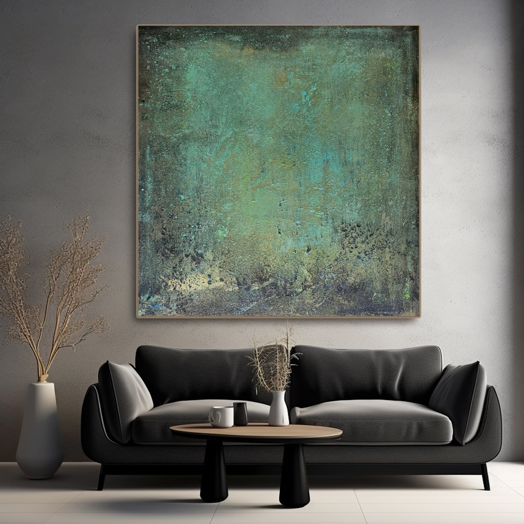 Square abstract artwork in earthy tones styled in a serene open-plan room