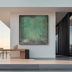 Mid-century abstract green canvas art styled in a minimalist beige living room