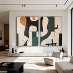 Mid-century geometric abstract canvas art in modern living room with orange, black, teal accents