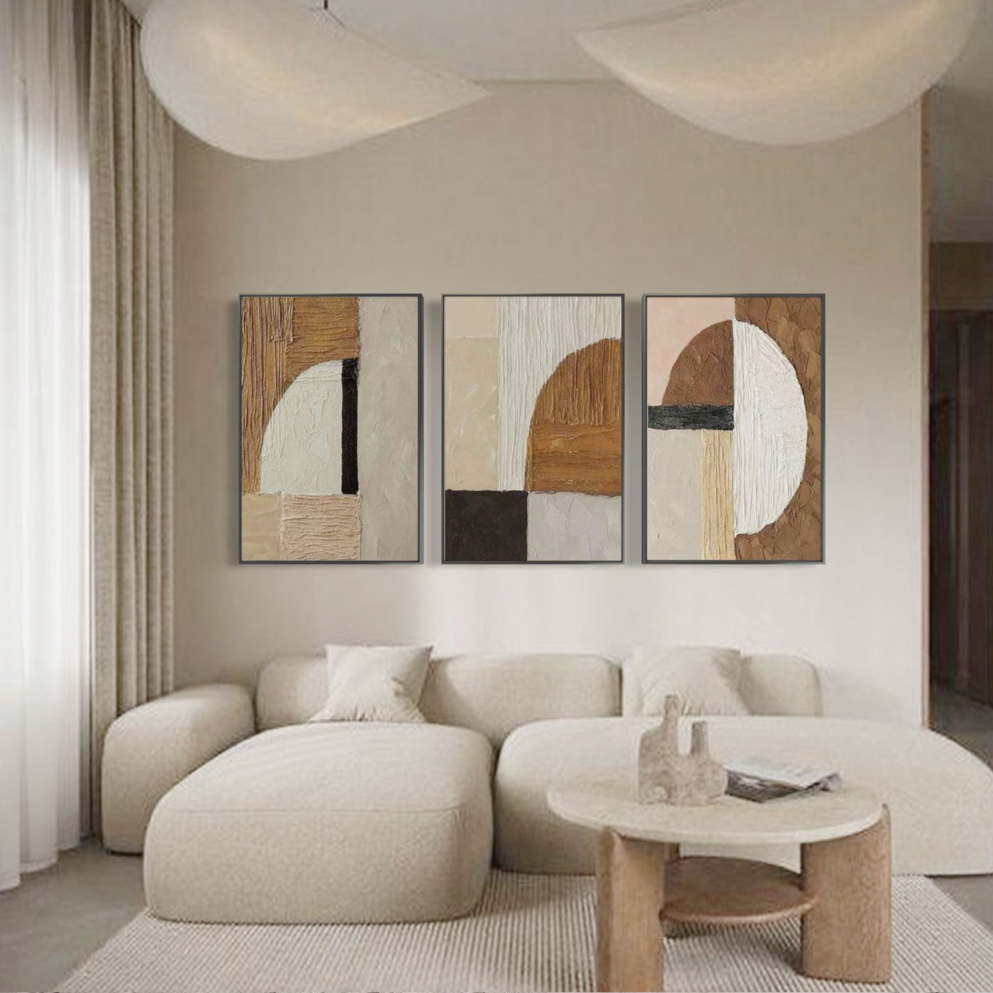 Neutral tone Fragment geometric art hanging above a beige modern sofa.