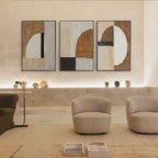 Fragment geometric canvas art displayed in a minimalist seating area.