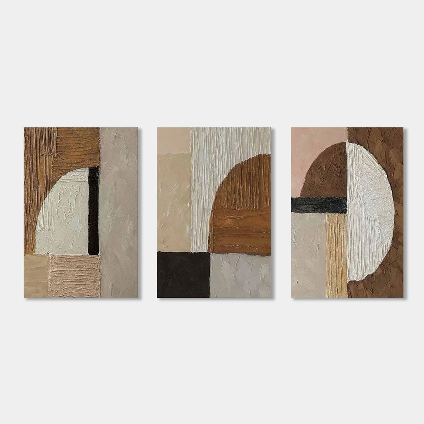 Close-up of three framed Fragment canvas art pieces with geometric designs.