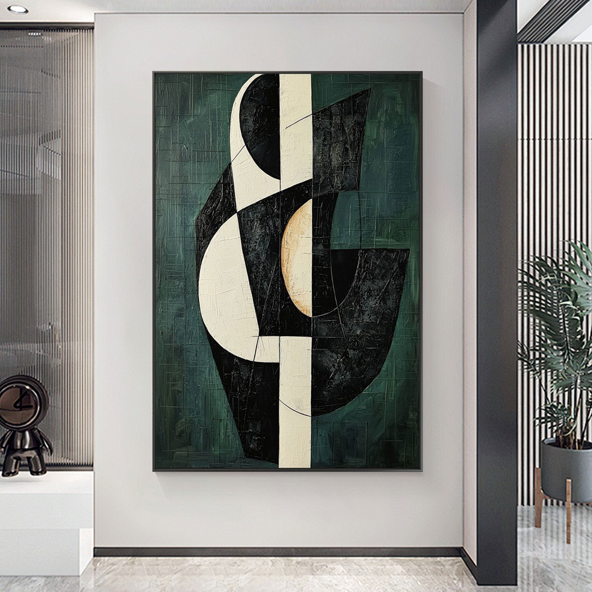Mid-century modern geometric wall art in green, black, and ivory on display.