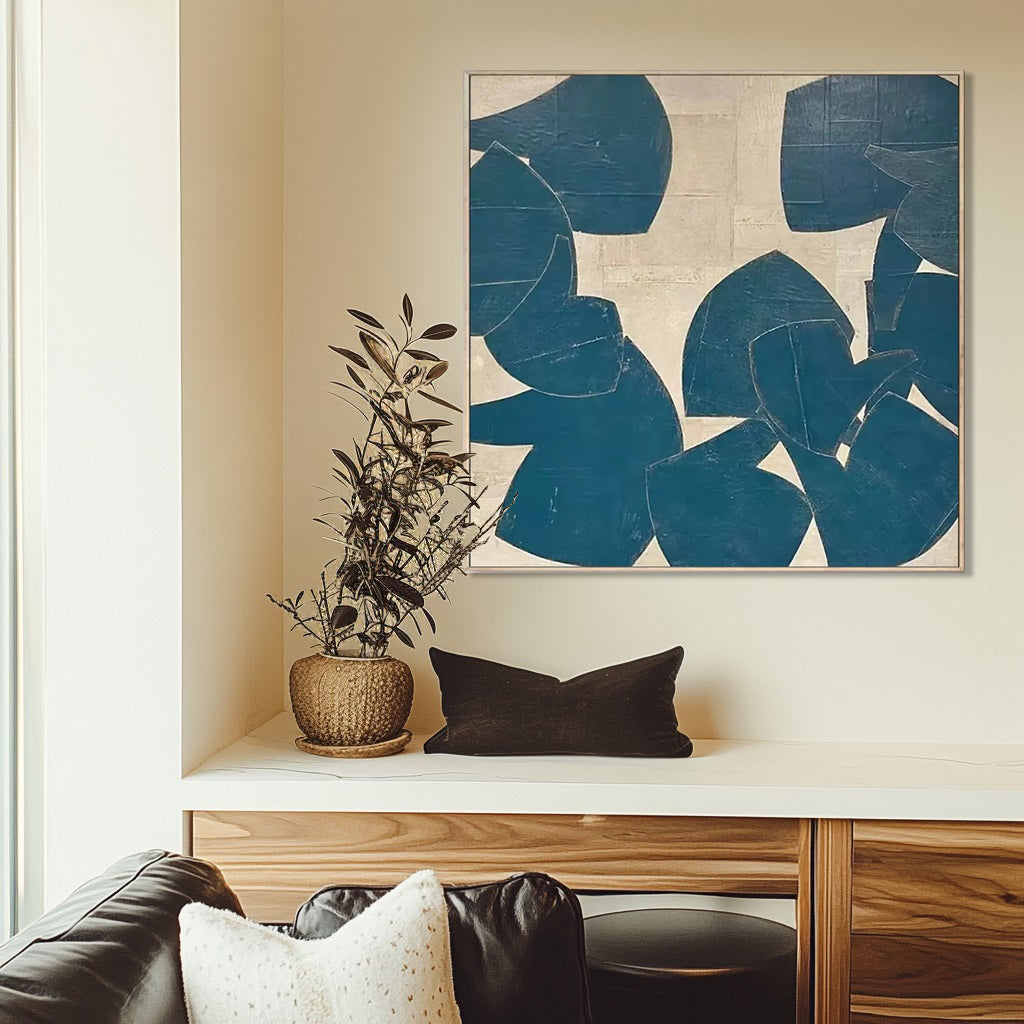 Modern teal abstract art on a wall above a console table.