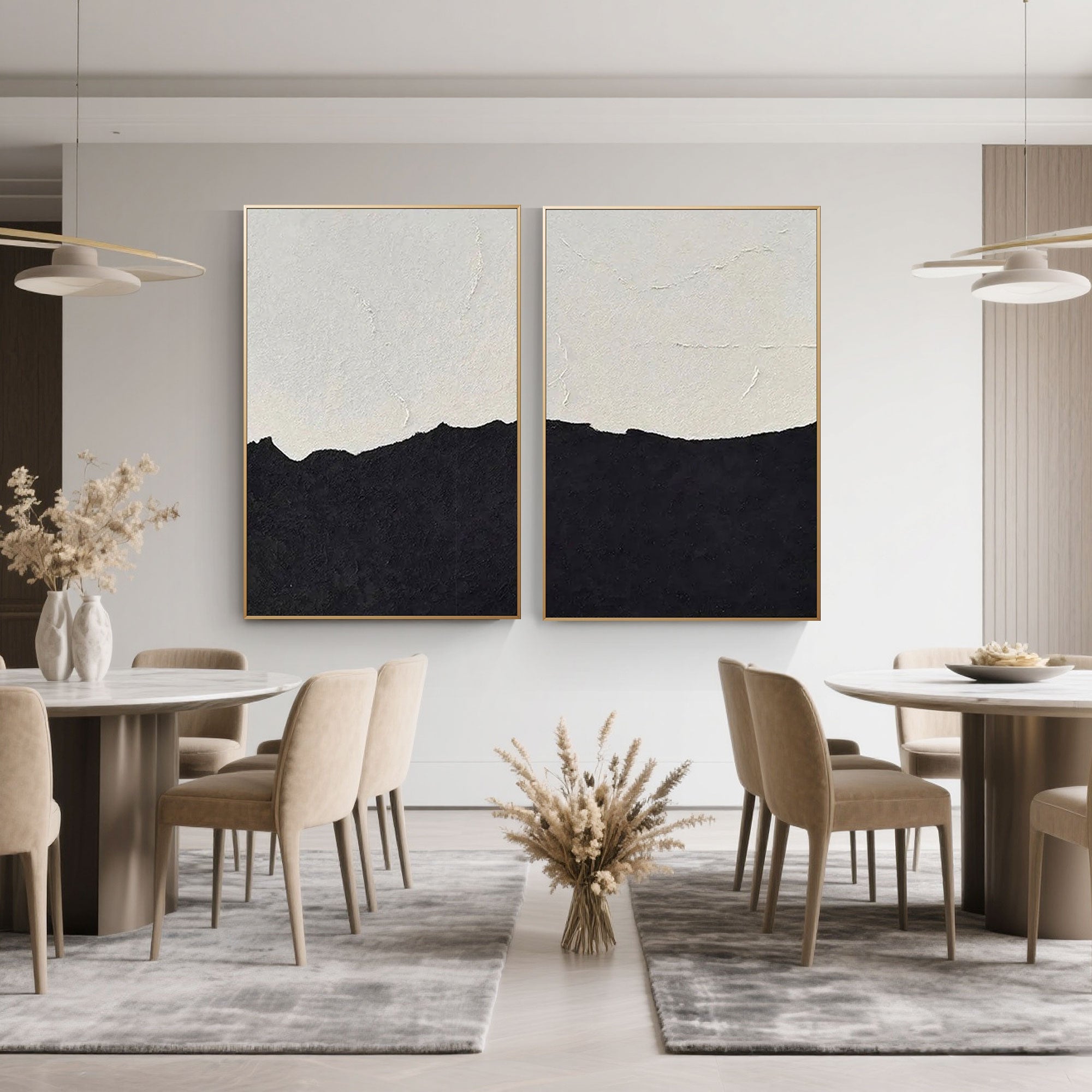 Minimalist abstract beach paintings hanging in a dining room setting.