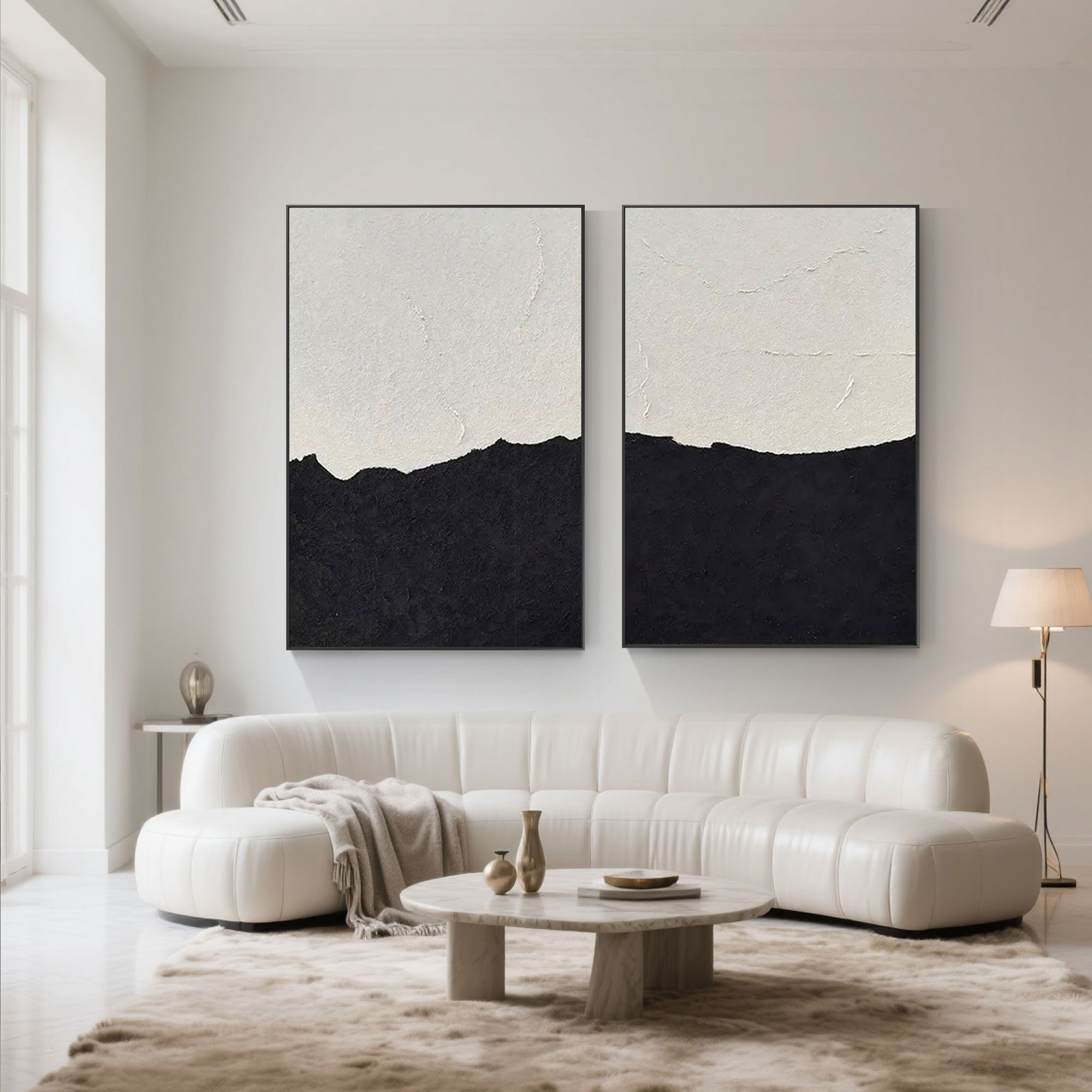 Minimalist beach paintings in a modern living room, black and white abstract art.