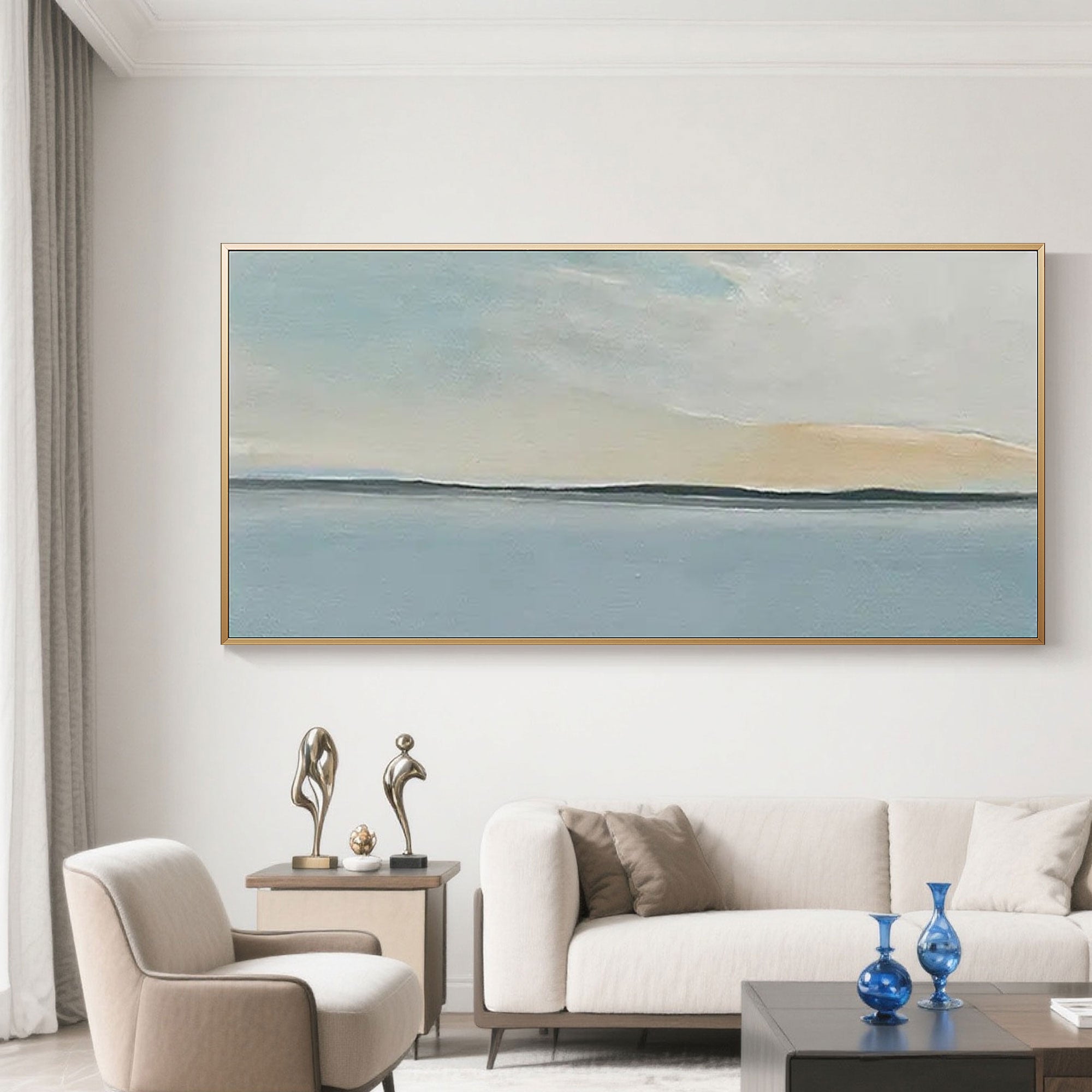 Abstract seascape painting in a gold frame displayed in a modern living room setting.
