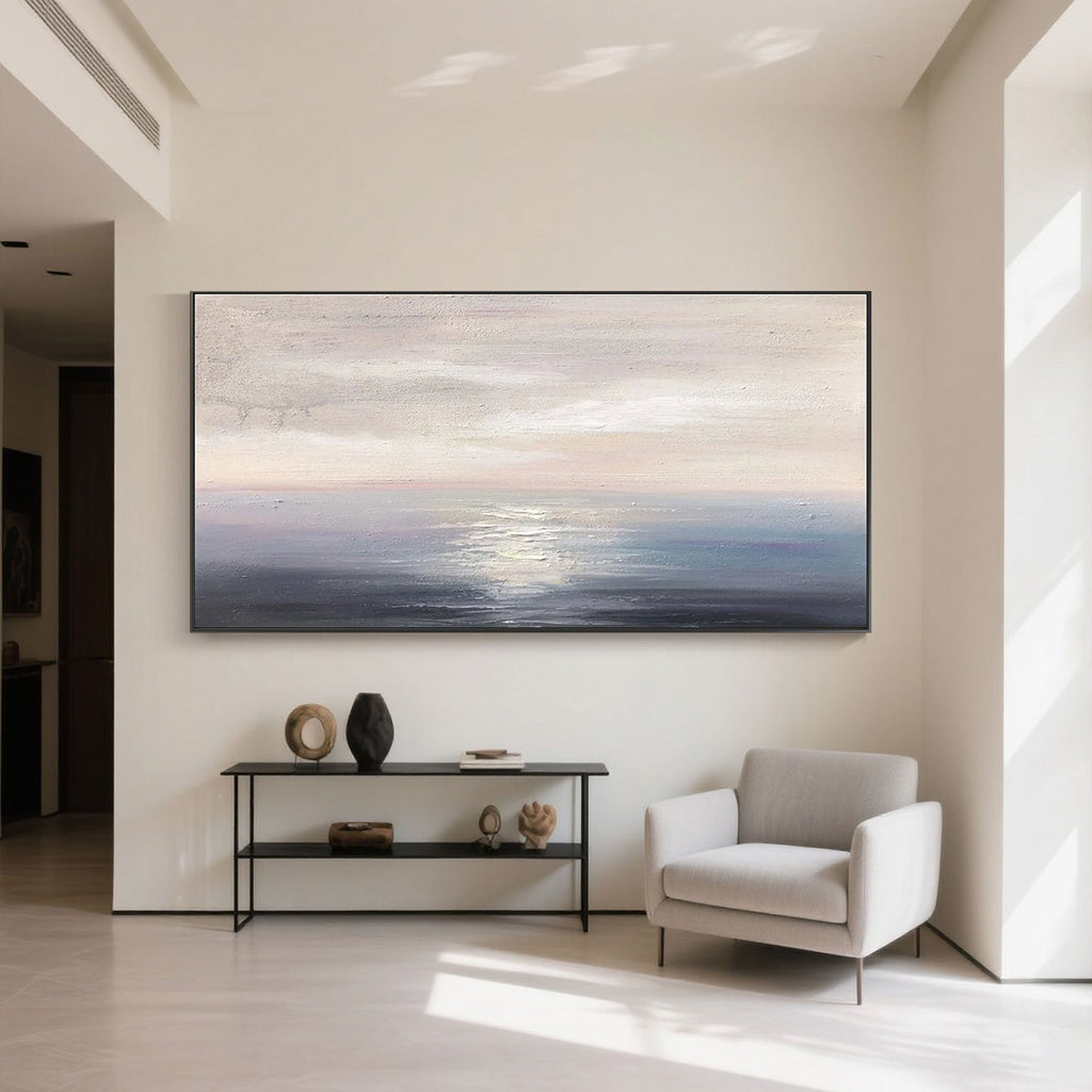 Minimalist sunrise seascape canvas art in a modern home interior.