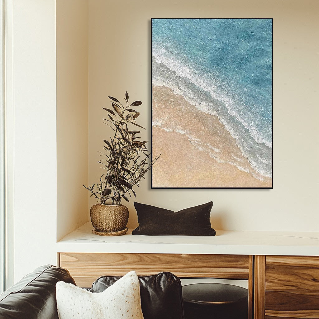 Minimalist beach art displayed above console table.