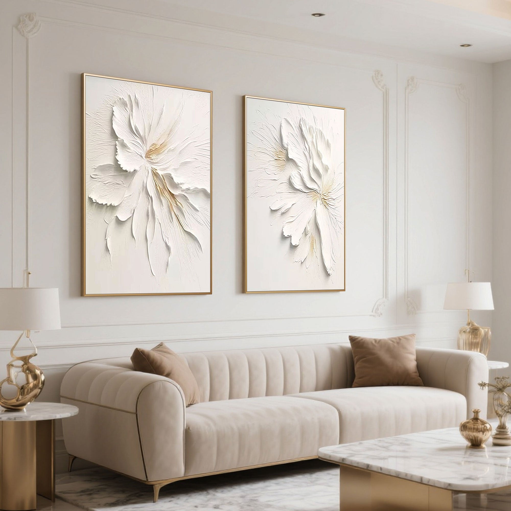 Beige sofa and gold accents compliment minimalist floral canvas art in a modern living space.