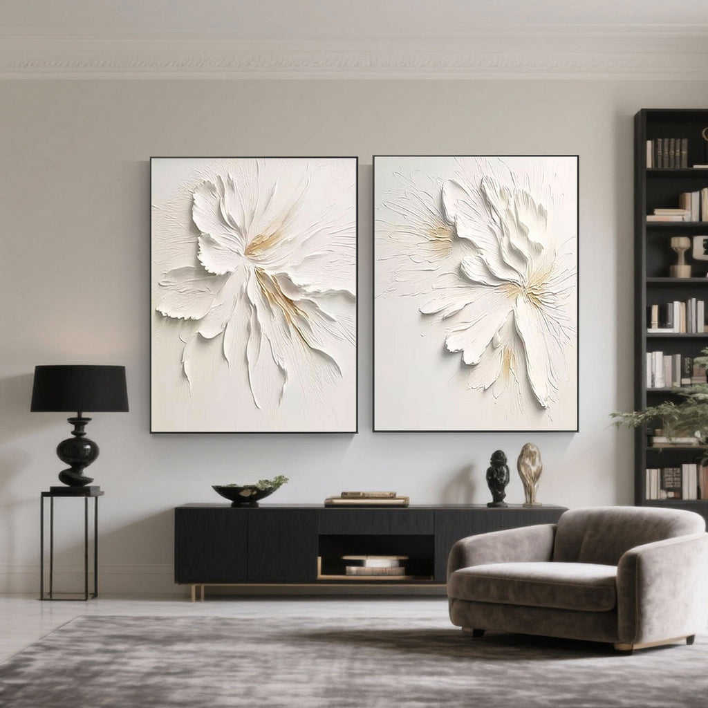 Modern room with black shelving, chair, and minimalist floral canvas art.