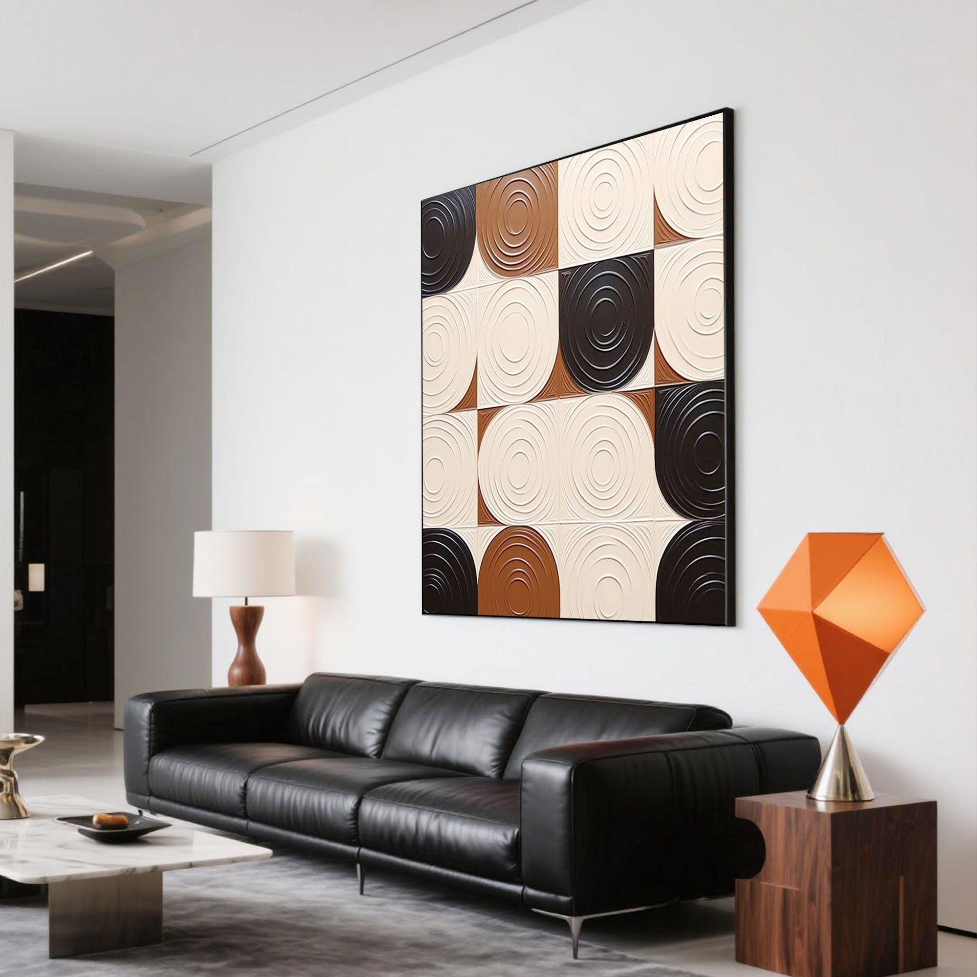 Modern abstract geometric 3D textured wall art featuring cream, brown, and black circular patterns, hand painted on square canvas, styled above a black leather sofa in a minimalist living room, museum-grade canvas, gallery-level packaging, eco-friendly materials.