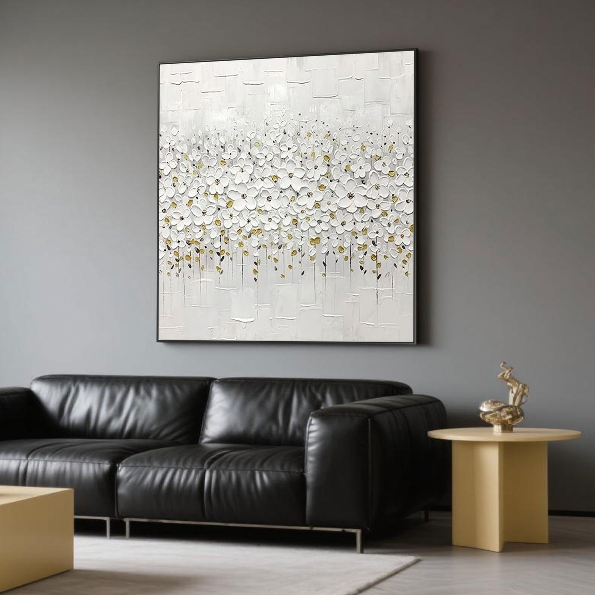 Textured white floral art with golden accents in a modern home interior.