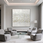 Hand-sculpted white blossom art with gold leaf on a square canvas.