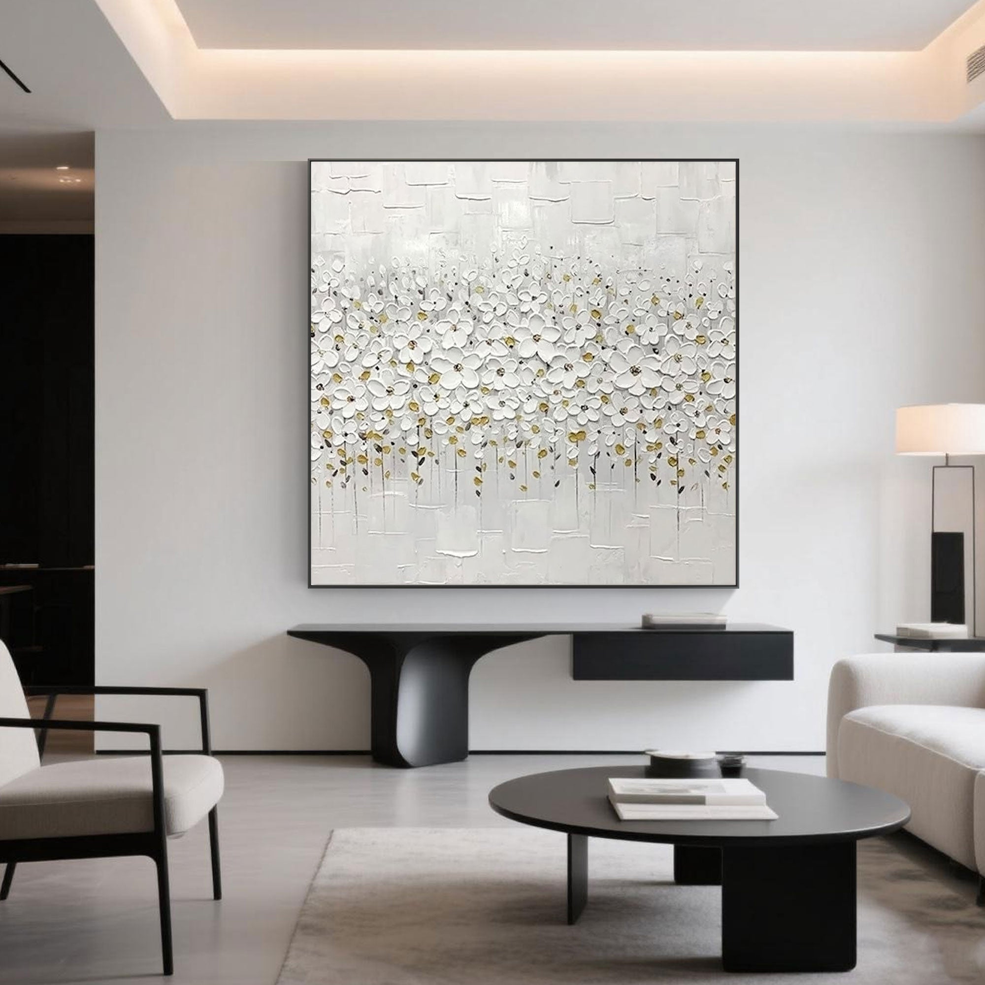 Minimalist white floral canvas art displayed in a modern living room setting.