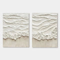 Minimalist wave trace diptych canvas art with textured white waves and neutral sand.