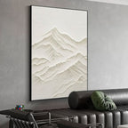 Modern living room with minimalist mountain art and black frame.