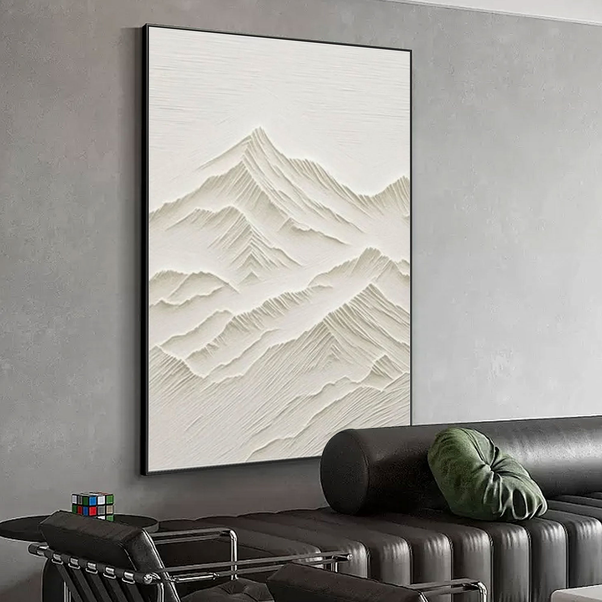 Modern living room with minimalist mountain art and black frame.