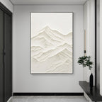 Neutral textured mountain wall art in a modern interior.