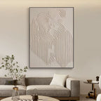Close-up of 'Traces' hand-painted canvas art with a black frame in a living space.