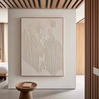 Modern bedroom decor with framed 'Traces' textured wall art above a side table.