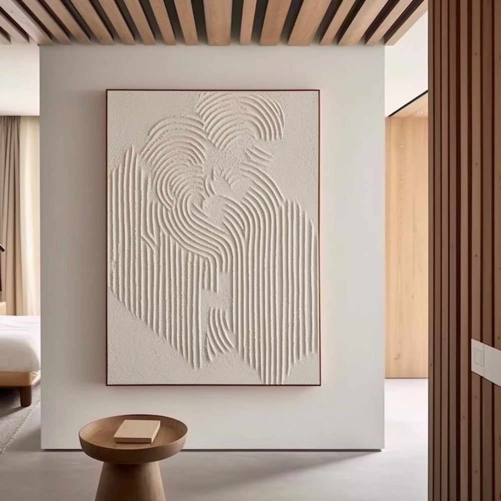 Modern bedroom decor with framed 'Traces' textured wall art above a side table.