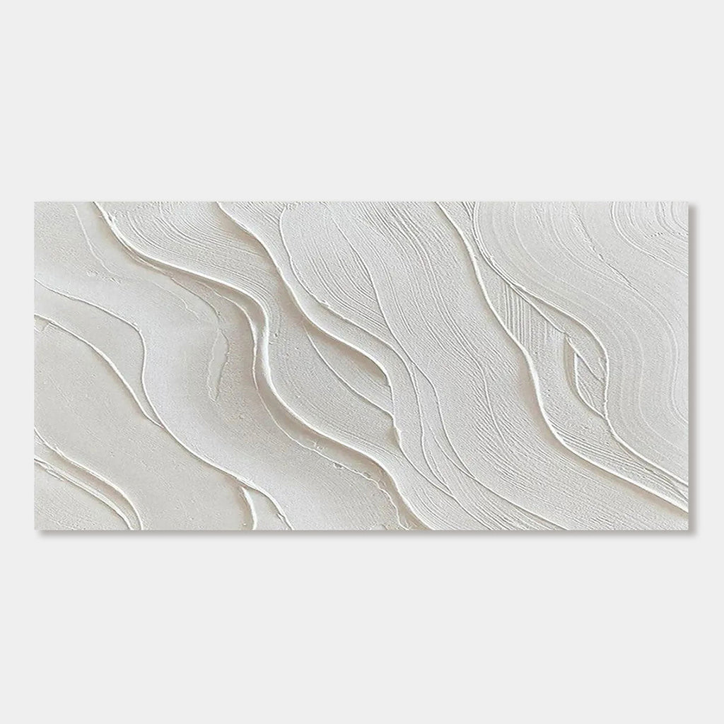 Close-up of minimalist wave wall art with soft, textured white waves.