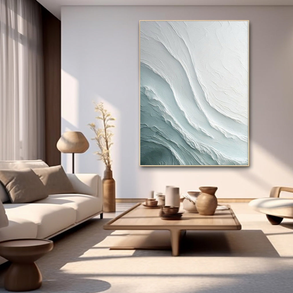 Cozy contemporary space with large wave canvas, plush sofa and decorative accents