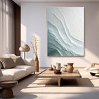 Cozy contemporary space with large wave canvas, plush sofa and decorative accents