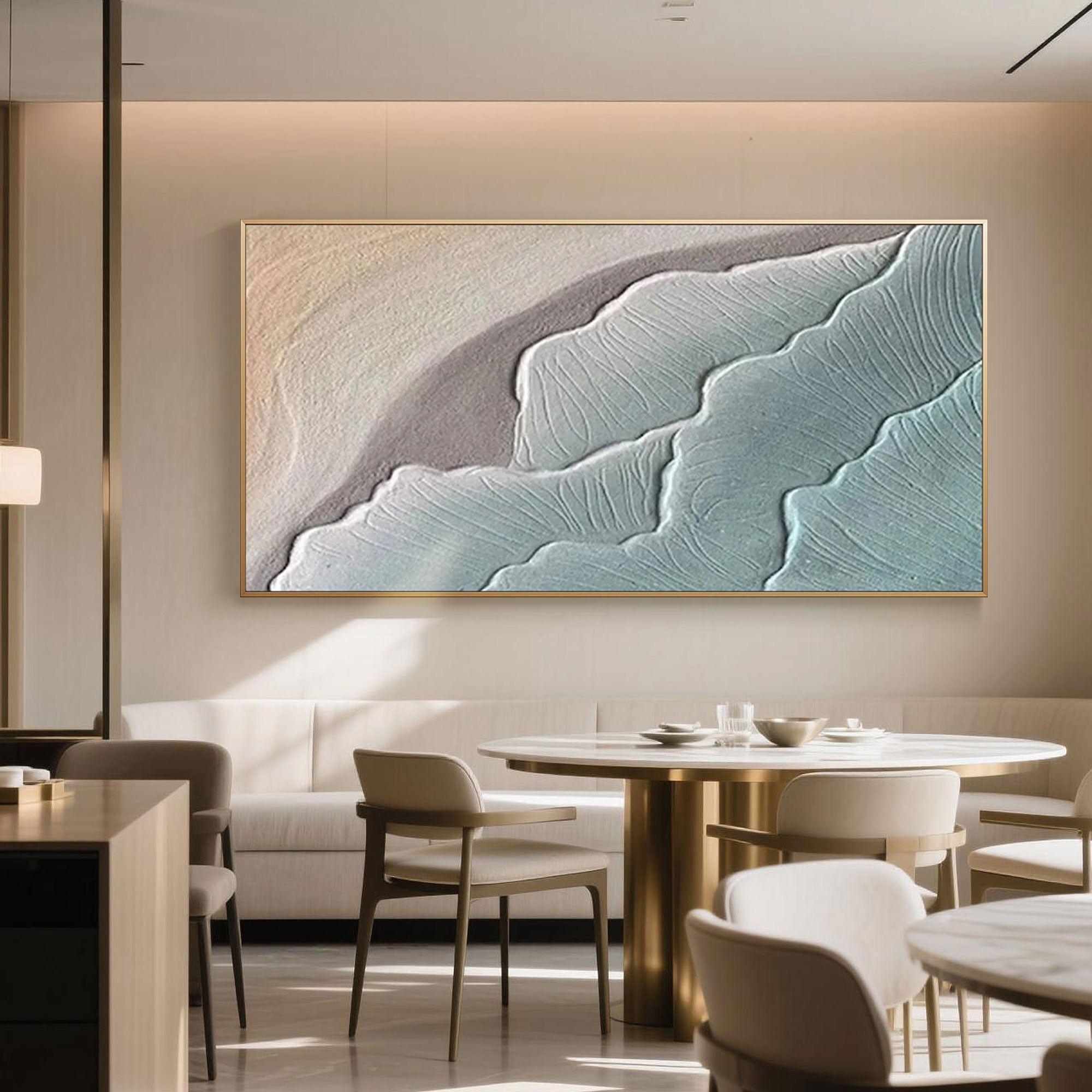 Elegant dining room decorated with a horizontal abstract ocean artwork in soft blues and beige, bringing tranquil vibes to contemporary interiors.