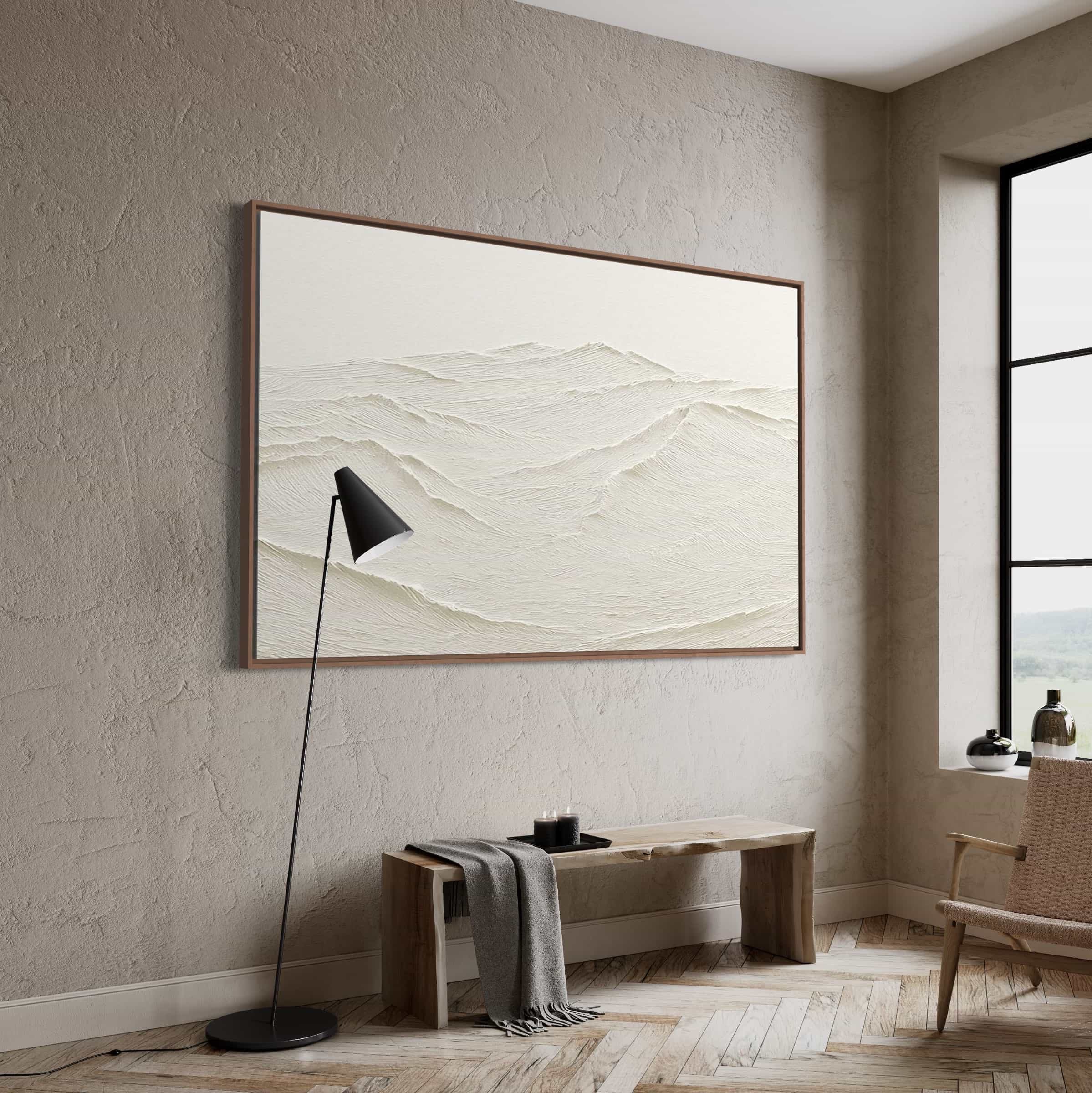 Minimalist textured abstract painting in neutral tones, featuring wave-like mountain ridge patterns, displayed as focal point on light-colored wall