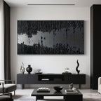 Angled view of minimalist black 'Silence' textured painting.