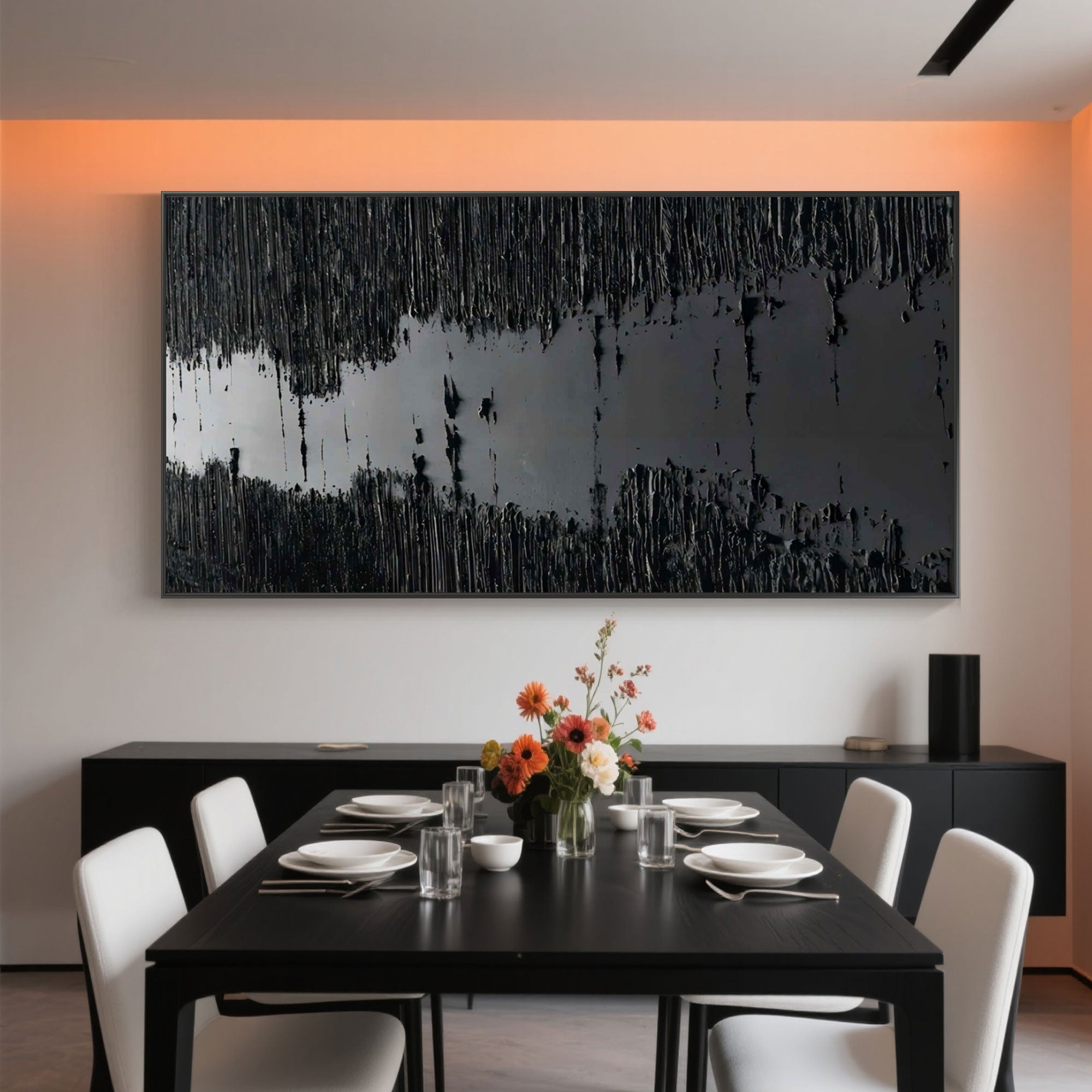 Modern dining room with textured black 'Silence' canvas art.