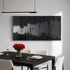 Black textured 'Silence' art above dining table with roses.