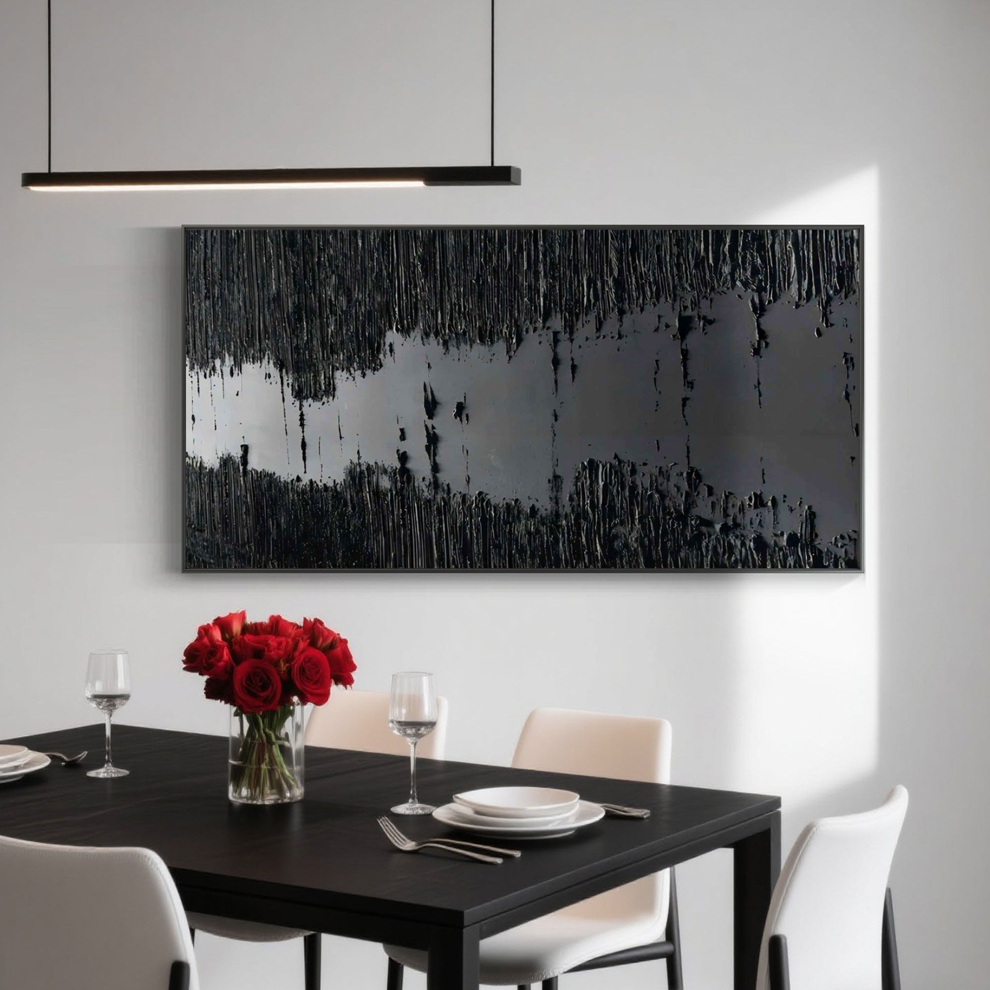 Black textured 'Silence' art above dining table with roses.