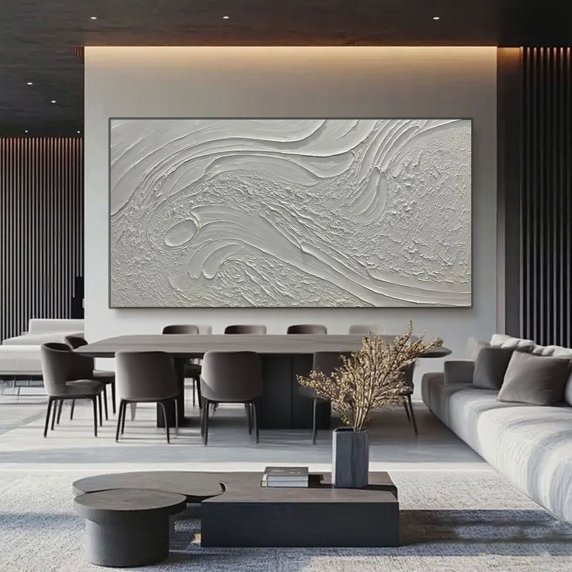 Beige and white textured canvas art displayed above a dining room table in a modern interior.