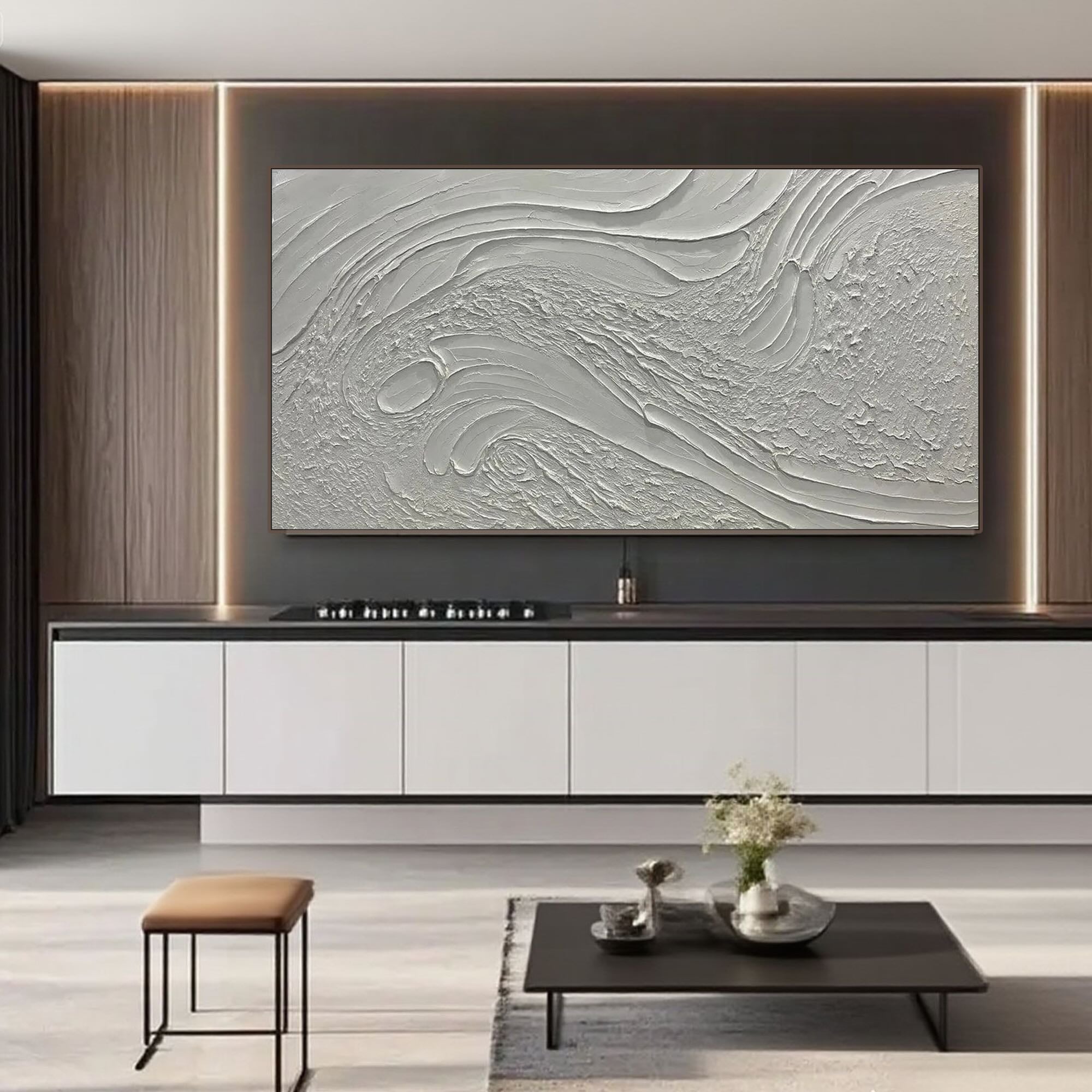 Beige and white textured canvas art displayed above a dining room table in a modern interior.