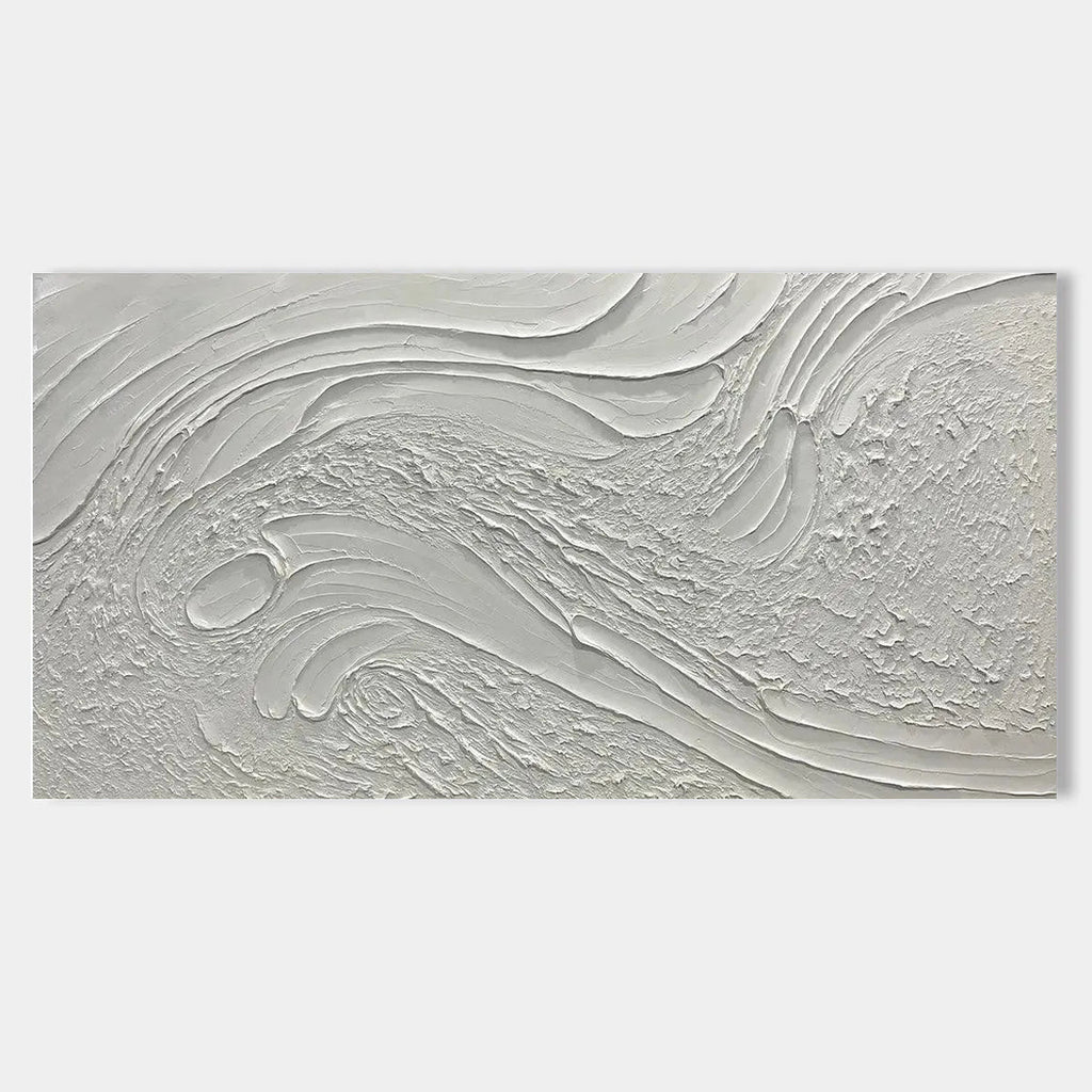 Close-up of a minimalist abstract canvas art with a heavy 3D texture in natural white tones.