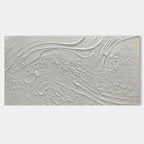 Close-up of a minimalist abstract canvas art with a heavy 3D texture in natural white tones.