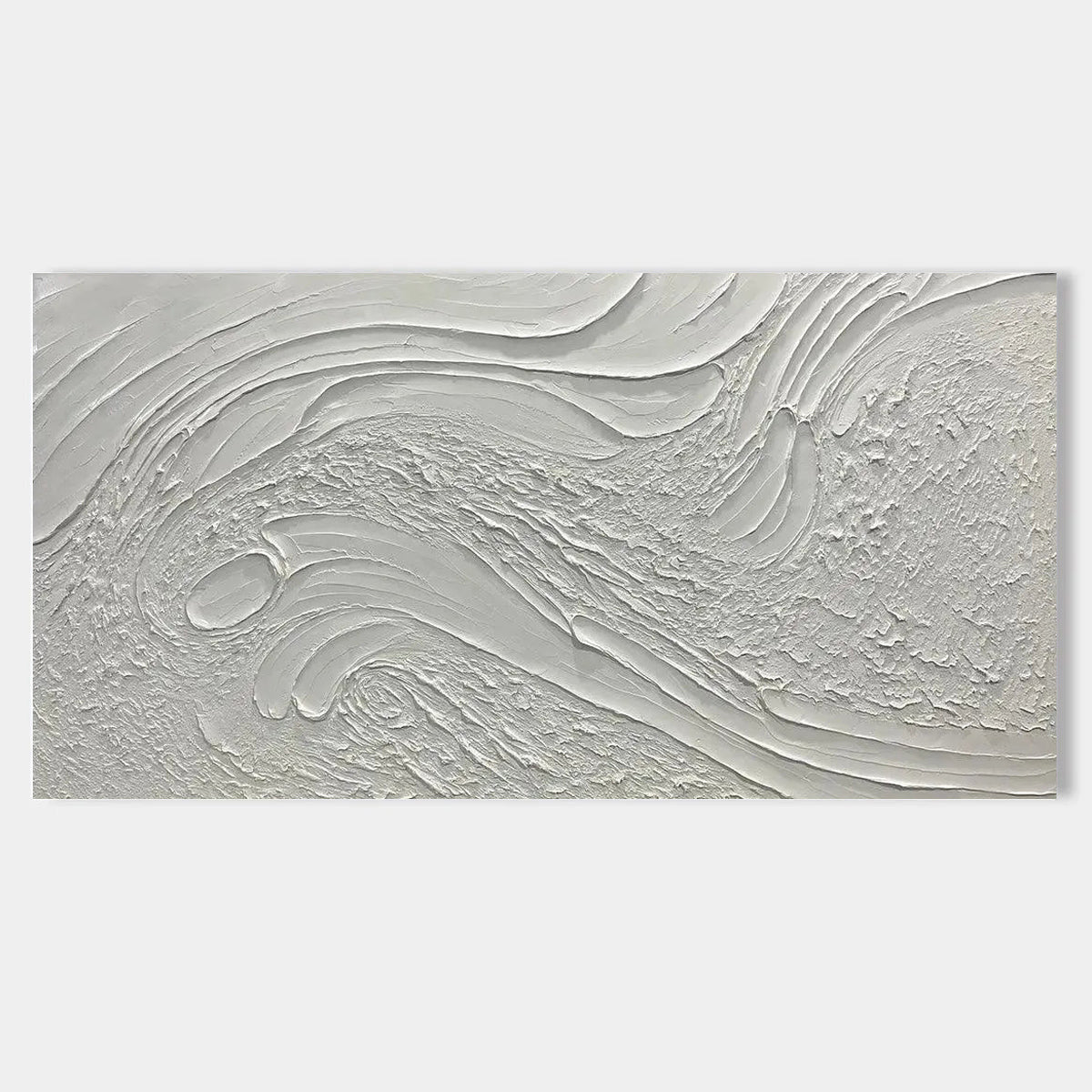 Close-up of a minimalist abstract canvas art with a heavy 3D texture in natural white tones.