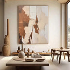 Minimalist abstract wall art with textured brushstrokes in earthy browns, beiges, and whites, displayed in a modern living room with neutral decor.